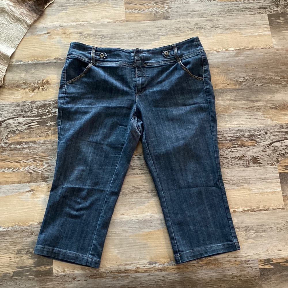 Worn capri blue jeans